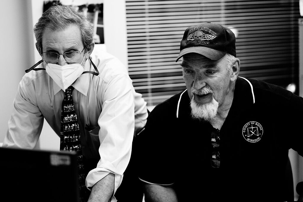 Director of Elections Art Auer and Polling Place Operations Manager Gary Roberts coordinate before Roberts has to go take equipment to one of Boone County’s 77 polling places.